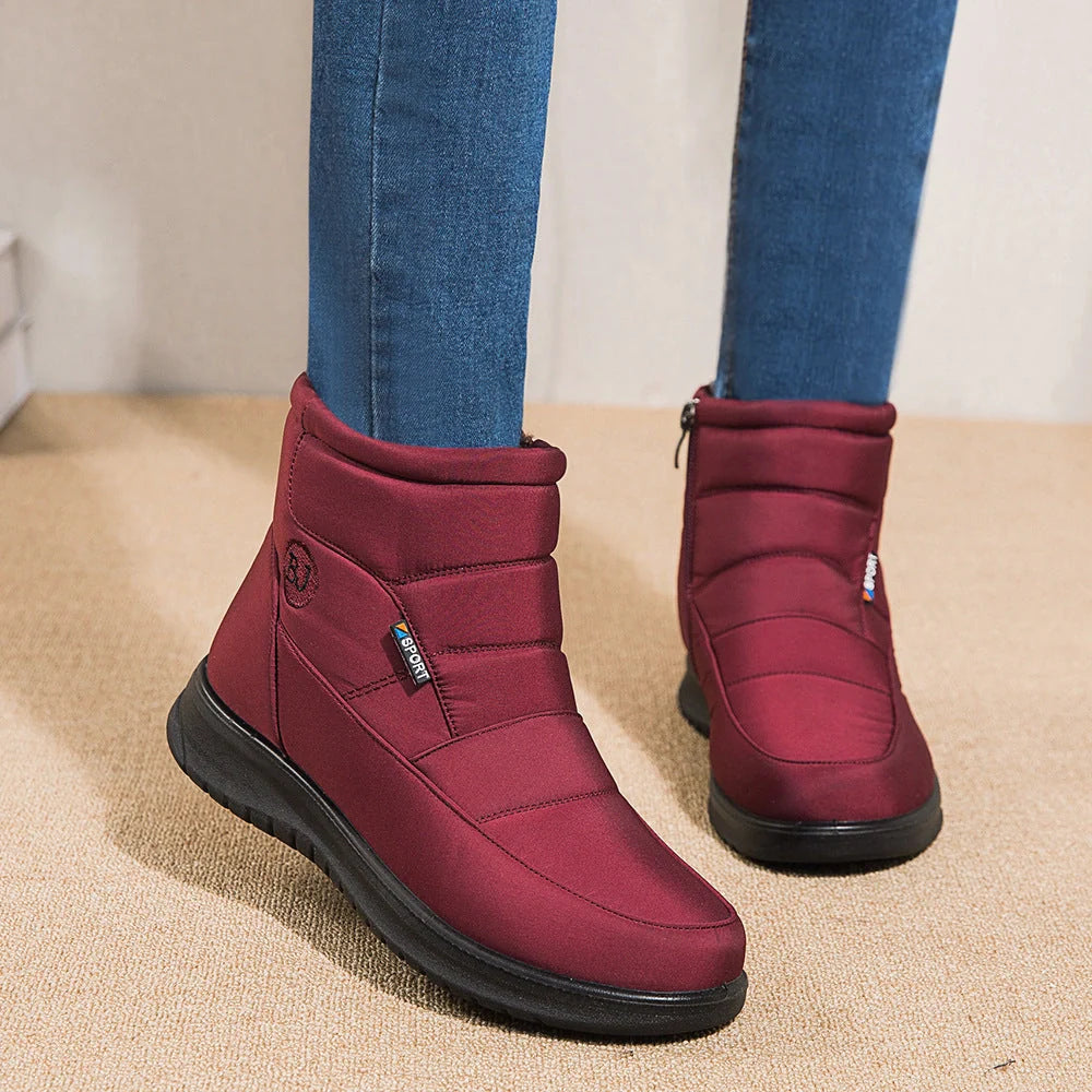 Women's waterproof snow boots in red, black, and brown with non-slip soles