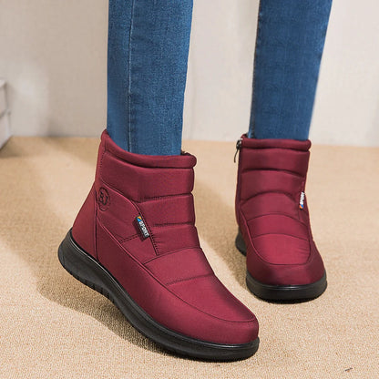 Women's waterproof snow boots in red, black, and brown with non-slip soles