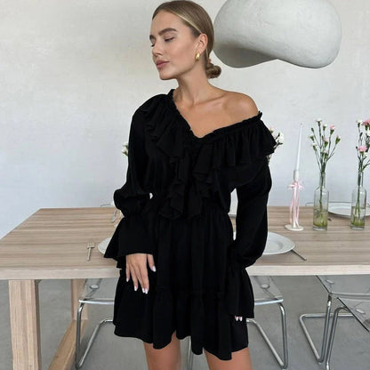 Stylish Y2K-inspired viscose dress with v-neck and flared sleeves, available in a range of vibrant colors