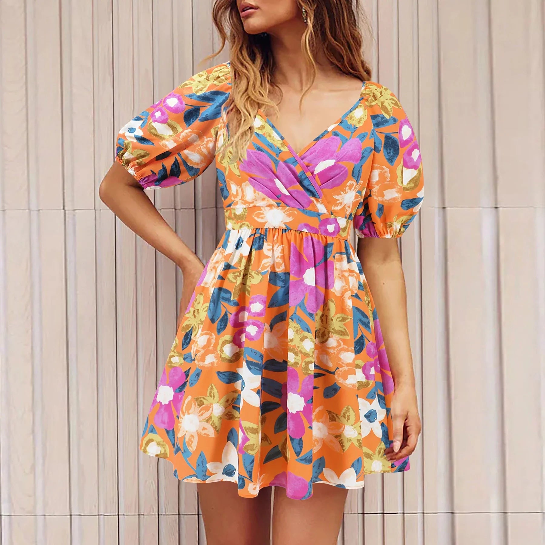 Stylish floral dress with V-neck and lantern sleeves, perfect for summer vacations and warm-weather occasions