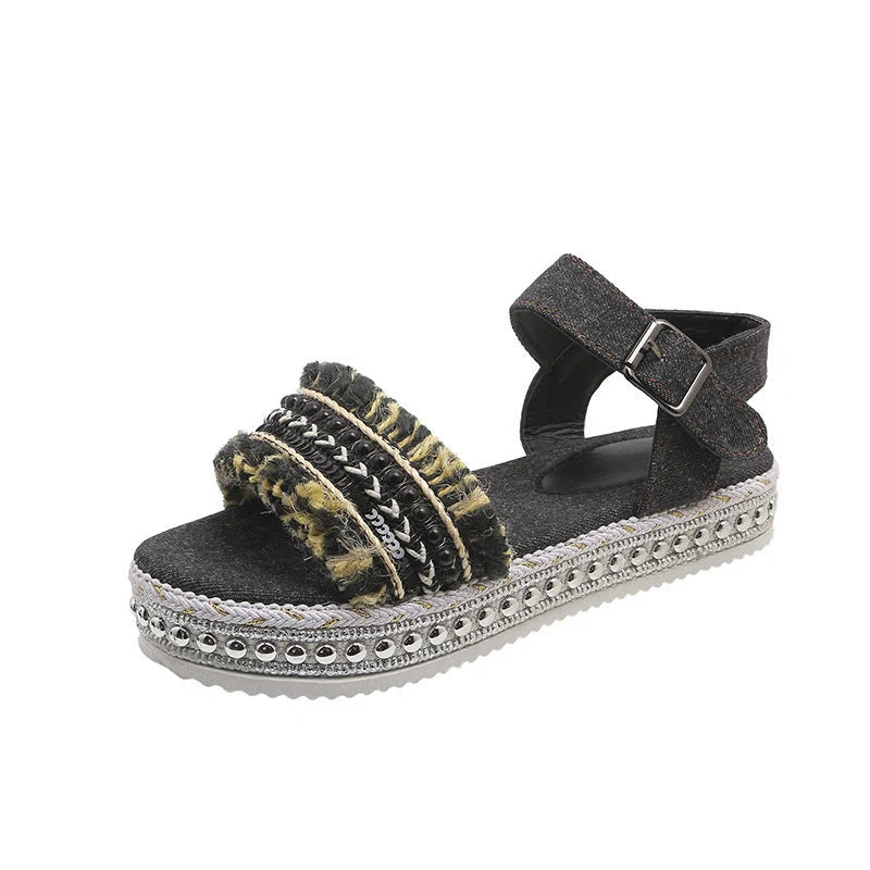 Stylish denim tassel sandals for women with thick flat sole, perfect for summer.