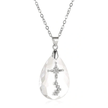 Elegant white drop pendant necklace with cross-chain design, made of premium electroplated alloy for a timeless and sophisticated look.