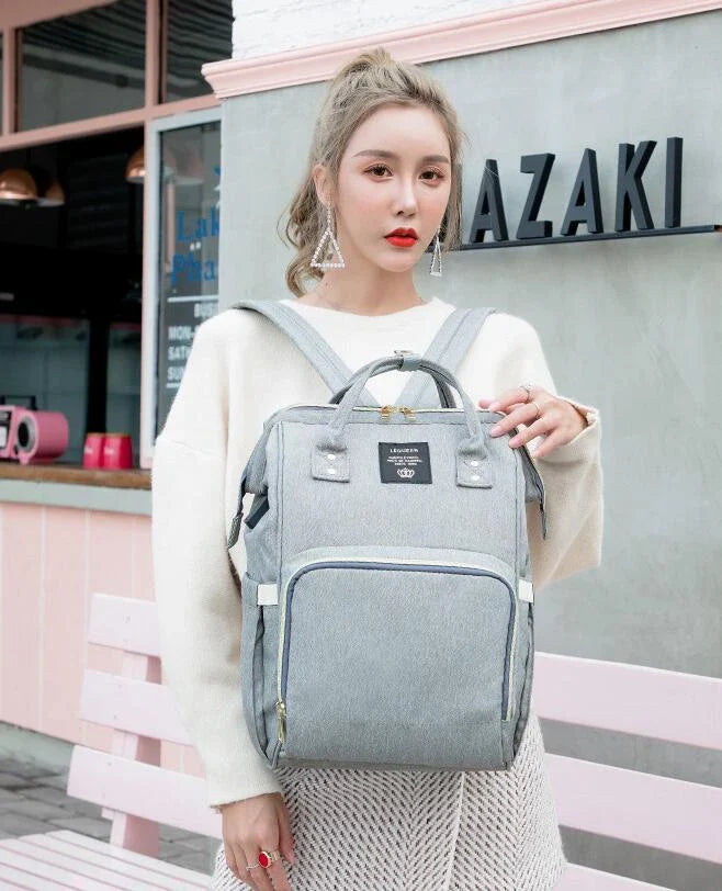 Premium mummy backpack in a range of stylish colours, featuring dedicated compartments for bottles, nappies and personal items.