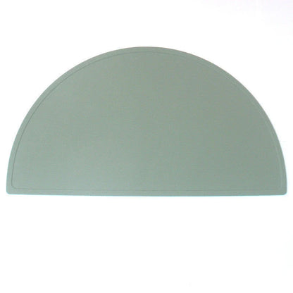 Durable silicone placemat in various colors, featuring waterproof and stain-resistant properties for easy cleaning