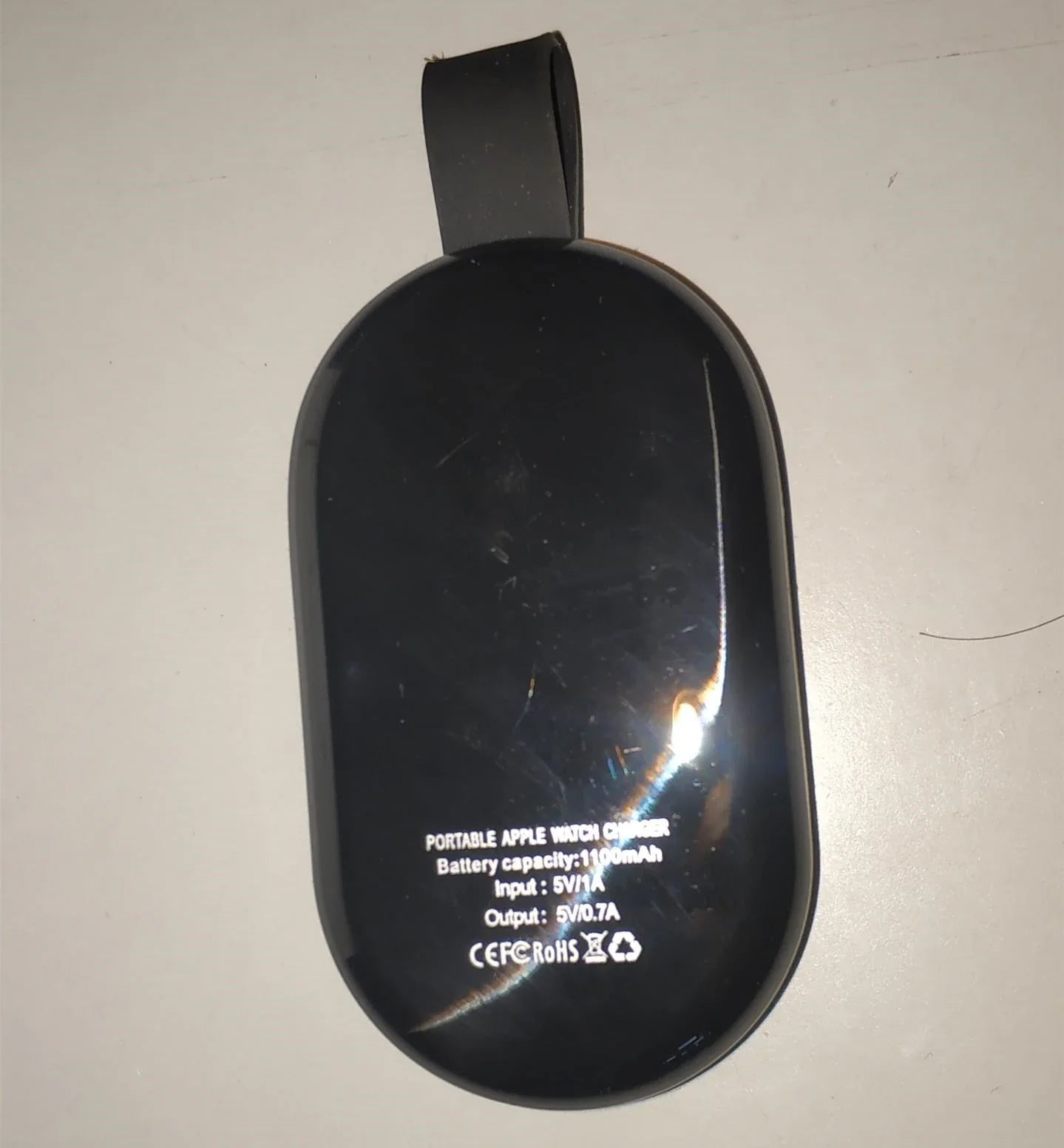 Premium wireless fast charger for smartphones, featuring a sleek and compact design for convenient charging on the go