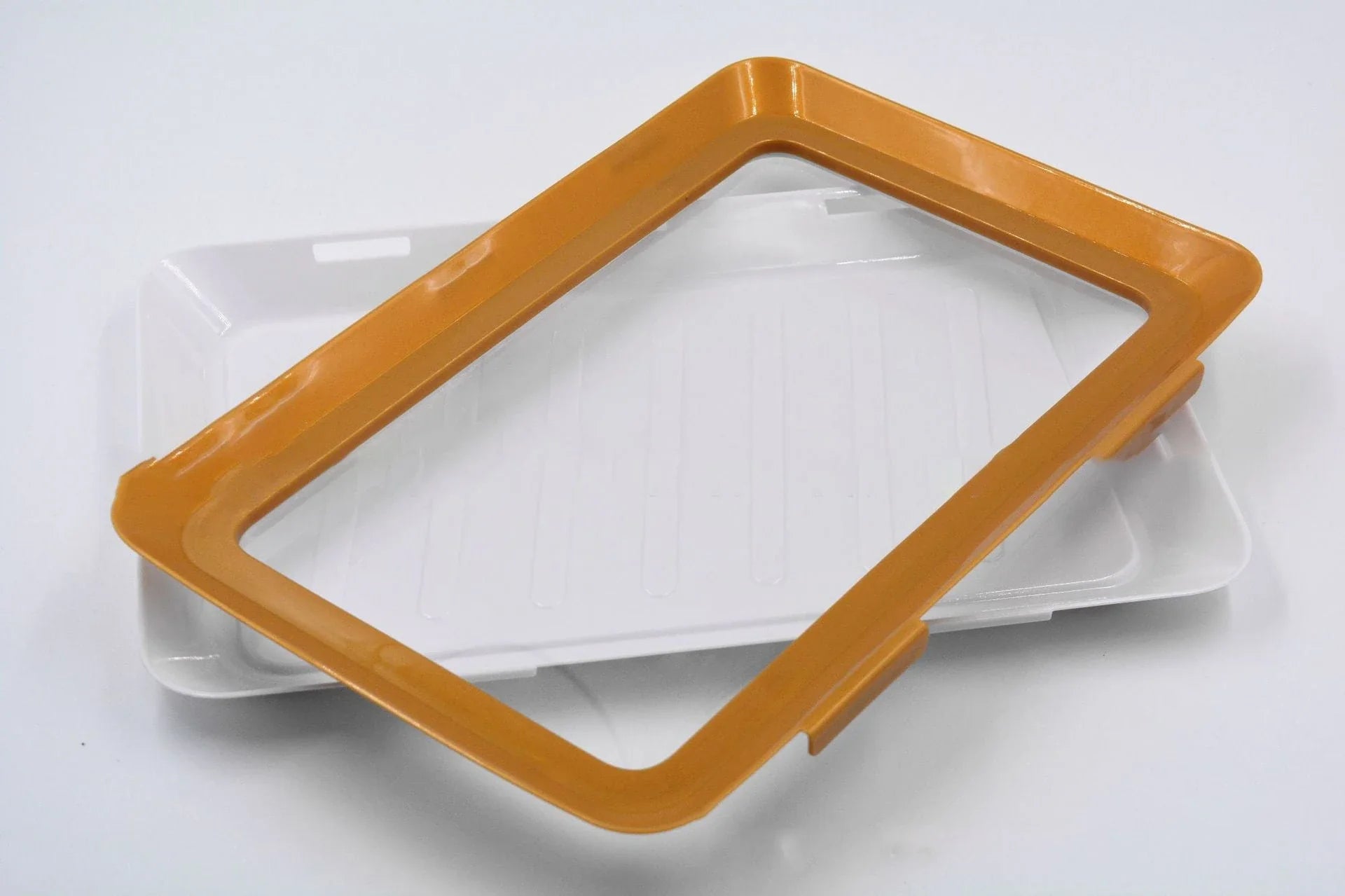 Premium food-preserving vacuum trays for fridge storage in black, green, red, and gold colours