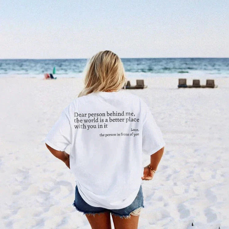 Women's graphic tee with playful slogan, available in various colors and sizes