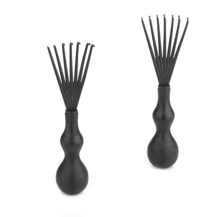A premium hair brush with a sleek design, featuring soft bristles and a rounded massage function for healthy, detangled hair