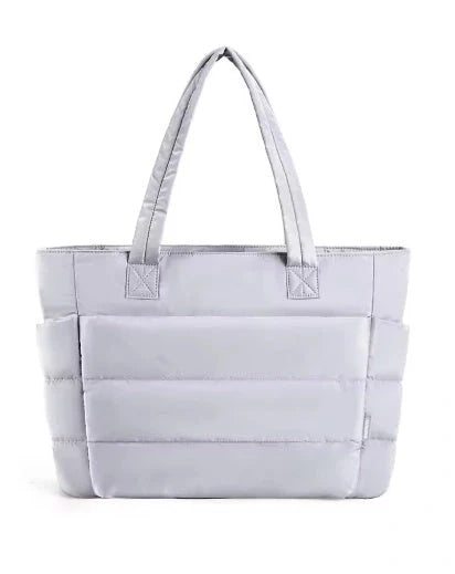 Premium cotton handbag with spacious design, secure zip-top closure, and thoughtful interior organisation for daily use
