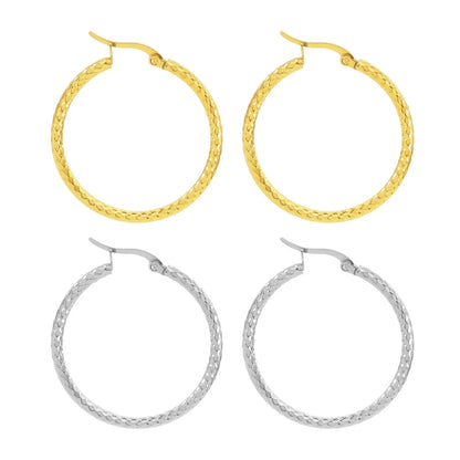 Elegant 18K gold-plated round ring earrings with embossed detail, perfect for any occasion.