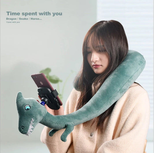 Cozy U-Shaped Pillow with Built-In Phone Holder in various colors, including Red Flamingo, Pink Unicorn, Orange Giraffe, Gray Snake, and Lagoon Dinosaur