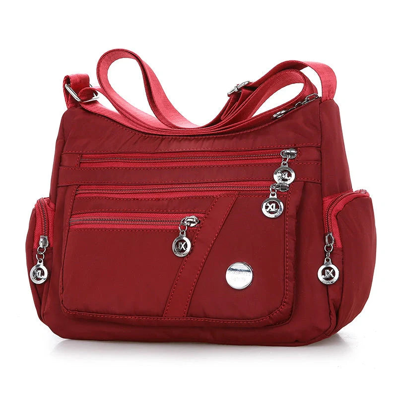 Ladies waterproof nylon oxford crossbody bag in various colors with multi-layer storage