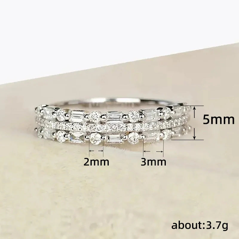 Elegant multilayer ring with a subtle geometric design, available in platinum, gold, and rose gold colours