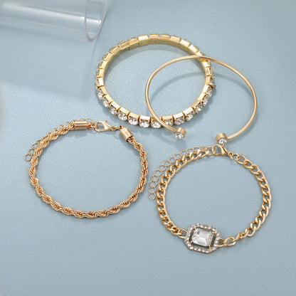 A set of four elegant crystal bracelets with vintage-inspired twisted cuff chains and sparkling rhinestones, perfect for adding a touch of luxury to any outfit.
