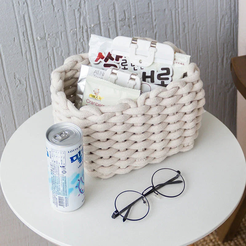 Hand-woven cotton rope storage basket in grey and white colours, featuring a minimalist nordic design for practical and stylish home organisation