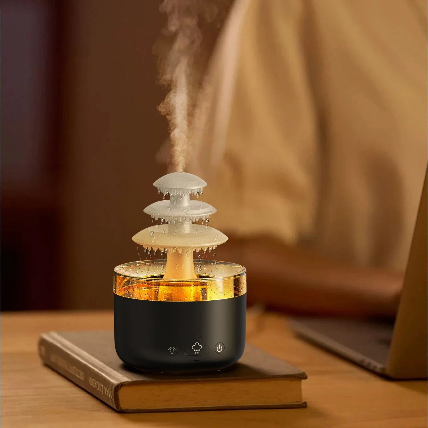 A white humidifier with a cloud-shaped design, featuring color-changing lights and essential oil diffuser capabilities.