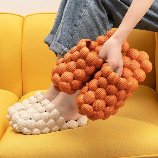 Comfortable massage bubble slides with breathable mesh upper and non-slip soles for indoor relaxation and pampering