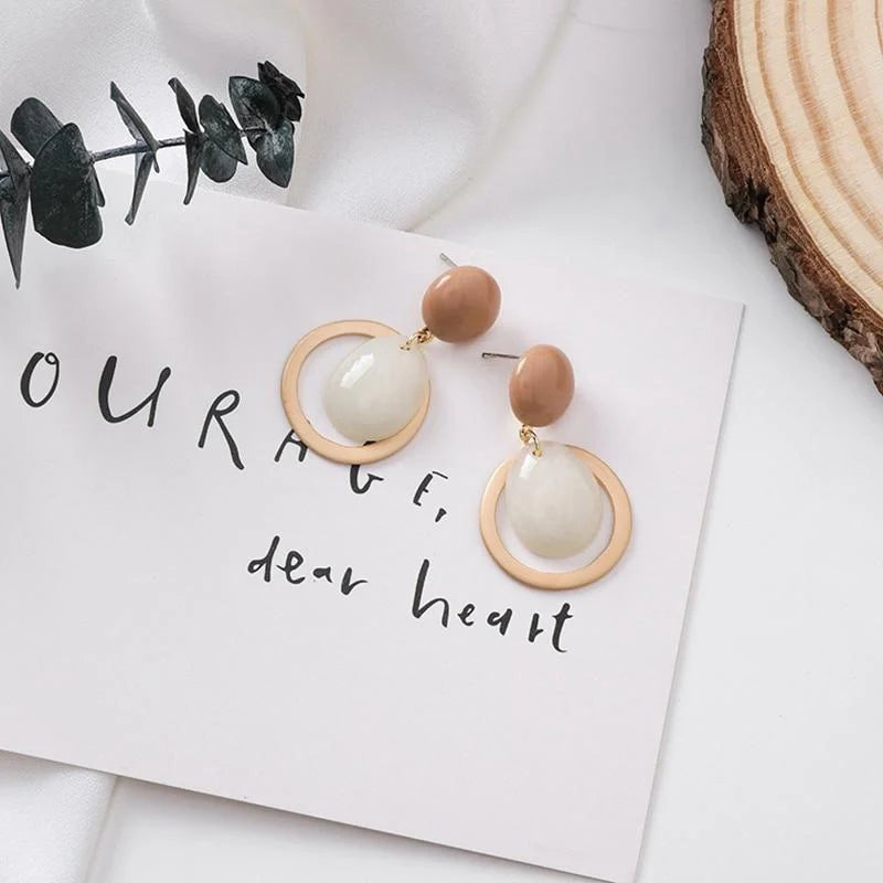 Elegant candy drop earrings in pink, green, and blue shades, showcasing a stylish and durable alloy design