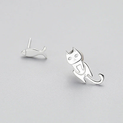 Elegant asymmetric 925 sterling silver stud earrings with cat and fish motifs, a modern and sophisticated accessory