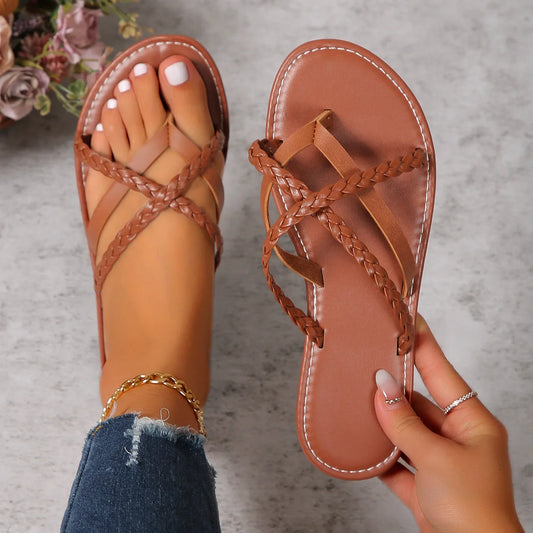 Women's cross-woven thong sandals with lightweight rubber sole, available in white and dark brown.