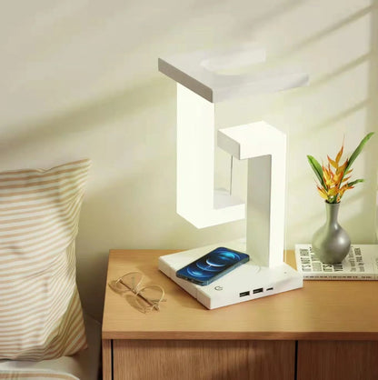Floating table lamp with wireless charging for smartphones in modern minimalist design