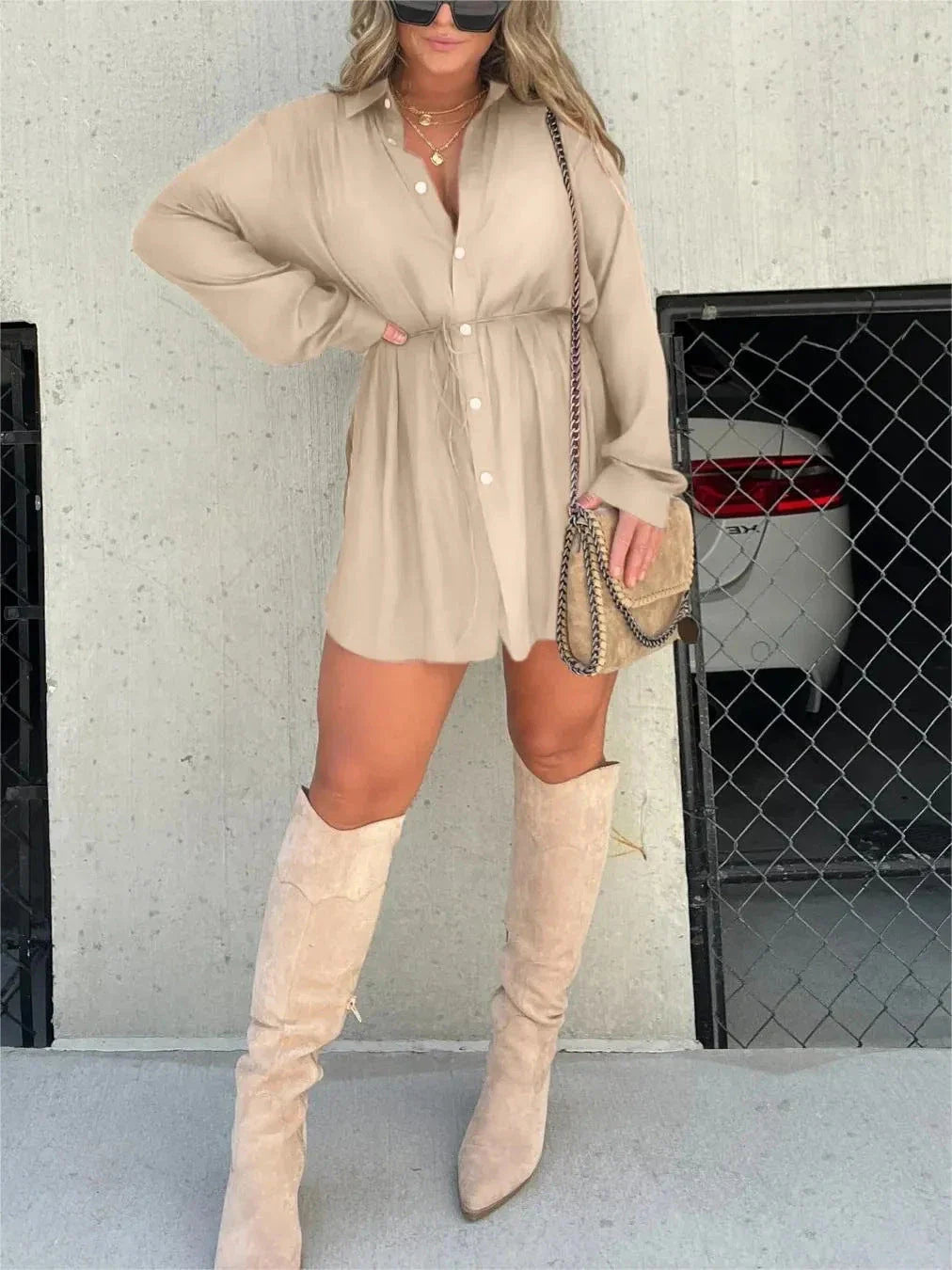 Women's long sleeve jumpsuit with button accents in various vibrant colors