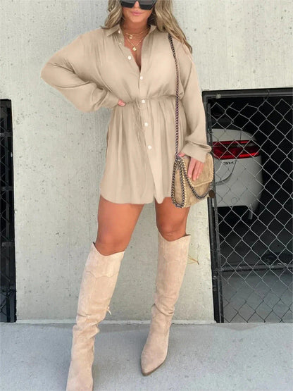 Women's long sleeve jumpsuit with button accents in various vibrant colors