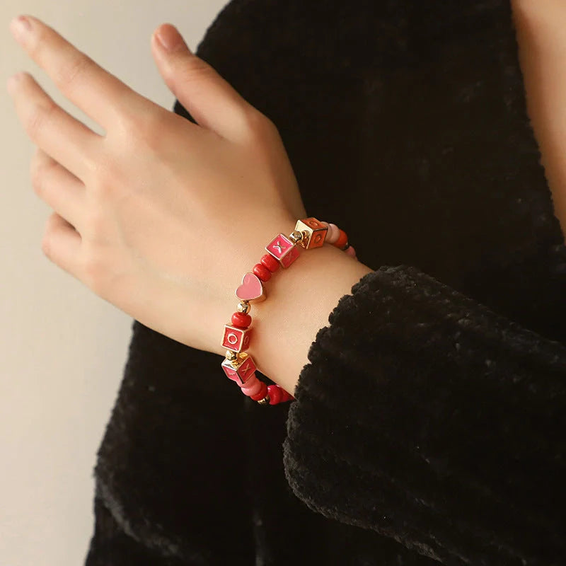 Elegant necklace and bracelet set with delicate beads and English letter charms, crafted with premium alloy materials