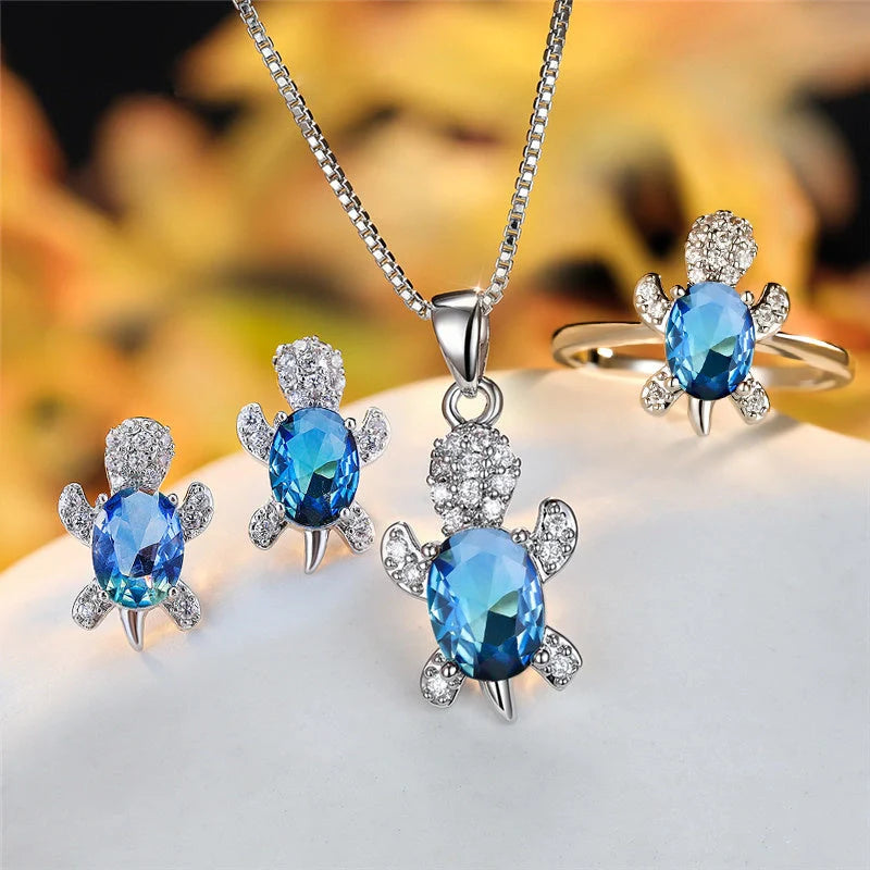 Stylish turtle pendant necklace with vibrant rainbow stones, perfect for women and children.