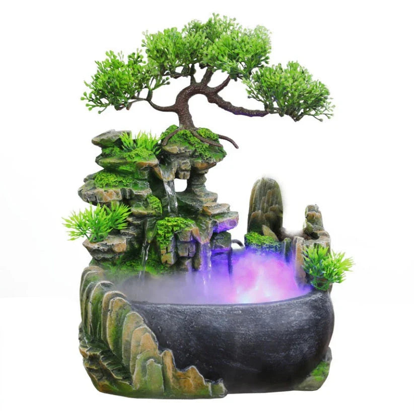 A desktop water feature with a rockery design, flowing water, and an optional mist function for creating a calming and relaxing ambience in home or office spaces.