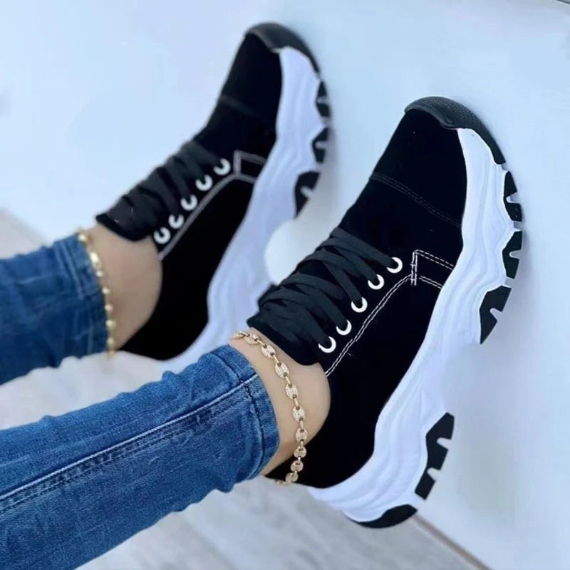 Women's platform sport flats in black, red, blue, and pink with lace-up design
