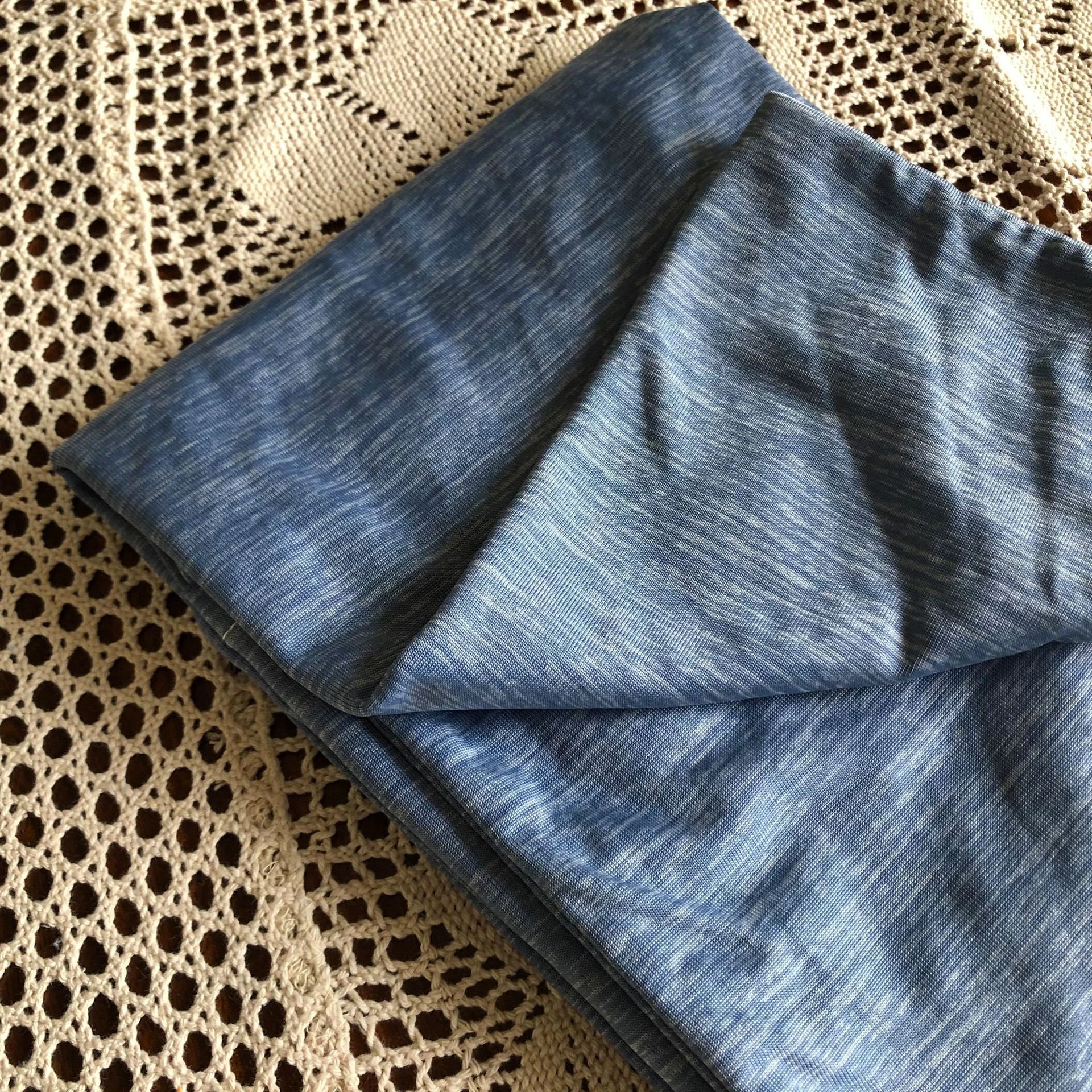 A premium polyester cooling blanket with innovative Japanese cooling fibers that provides refreshing temperature regulation for a comfortable sleep experience