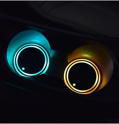 Colorful car cup holder with LED light-up coaster, solar and USB charging, and non-slip surface for ambient lighting in the car