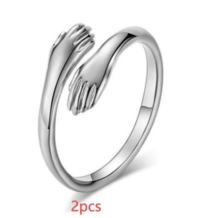 Adjustable Alloy Hands Hug Ring in silver and gold, stylish unisex jewelry