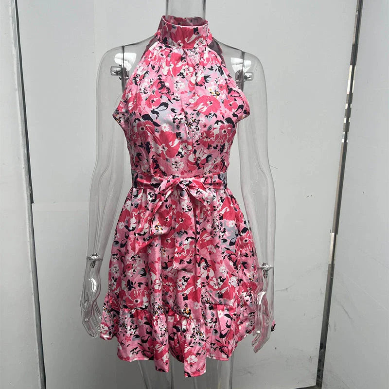 Stylish floral halter dress with ruffles and lace-up back, perfect for summer fashion
