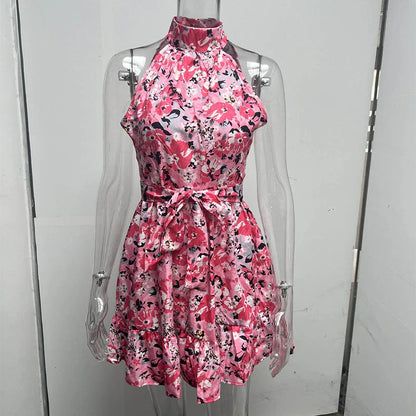 Stylish floral halter dress with ruffles and lace-up back, perfect for summer fashion