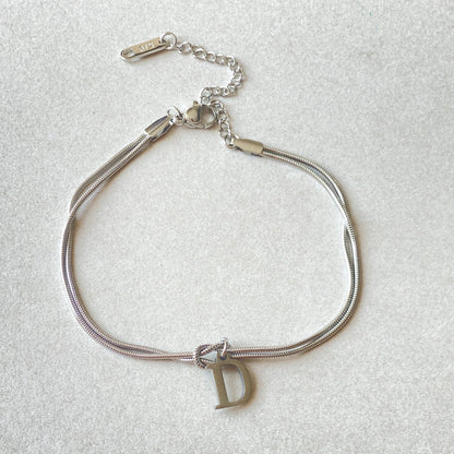 Personalised gold and silver love knot bracelets for couples, perfect as Valentine's Day gifts.