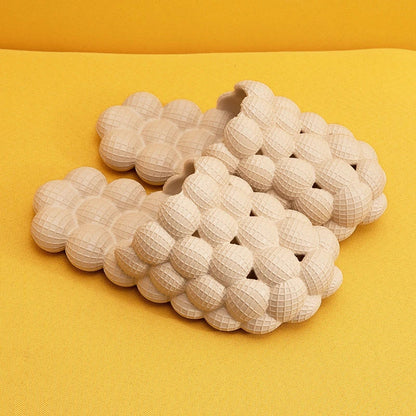 Comfortable massage bubble slides with breathable mesh upper and non-slip soles for indoor relaxation and pampering