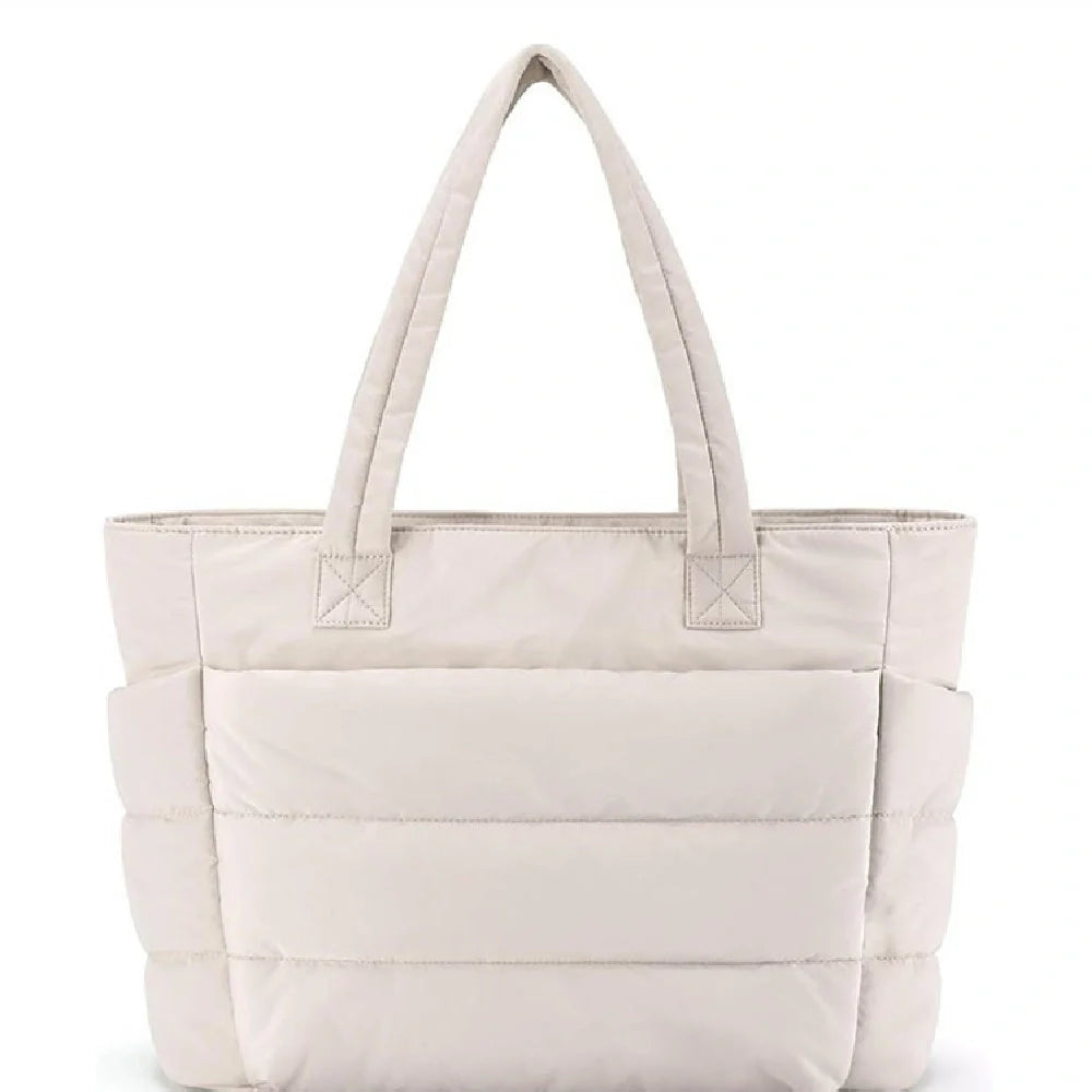 Premium cotton handbag with spacious design, secure zip-top closure, and thoughtful interior organisation for daily use