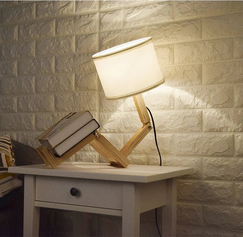 Humanoid table lamp with wooden base and white fabric shade, modern home decor
