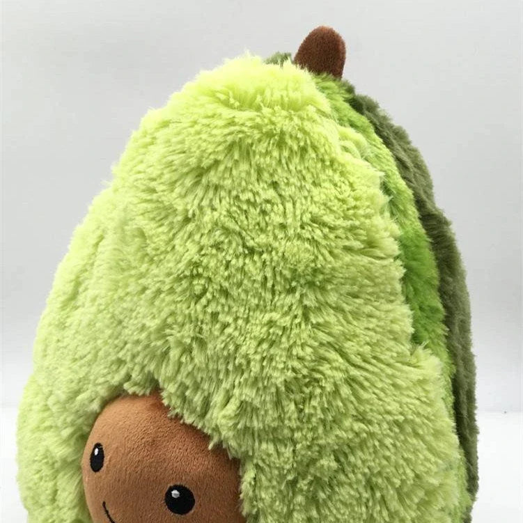Soft and cuddly plush avocado-shaped pillow in various sizes, perfect for decoration, relaxation, and playtime