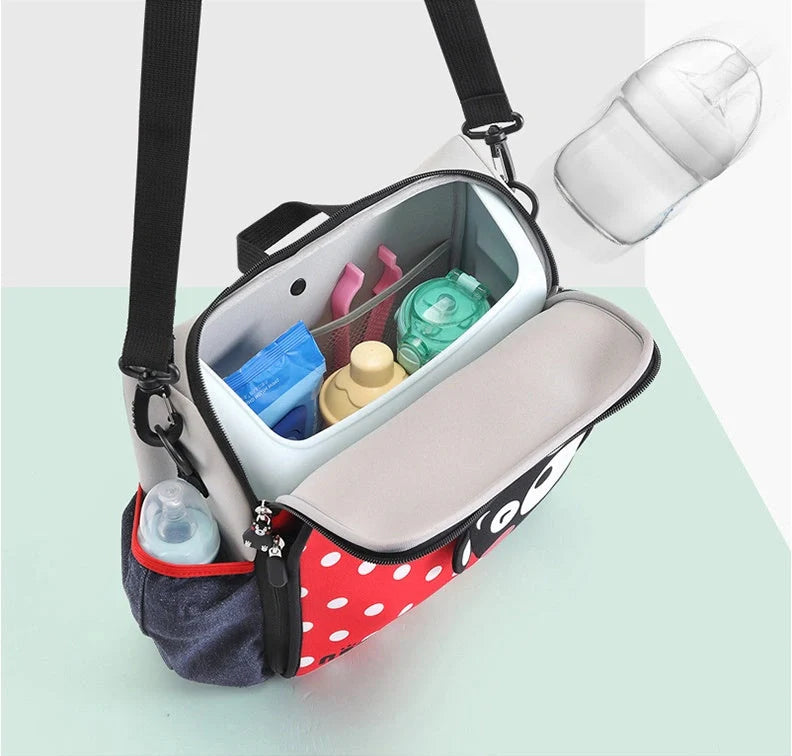 Multifunctional baby bag with portable child dining chair in yellow, perfect for parents travelling with babies