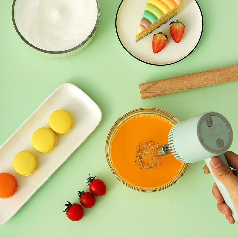 Rechargeable cordless electric hand mixer with 3-speed motor, whisk and egg beater attachments, and ergonomic design for easy baking and mixing