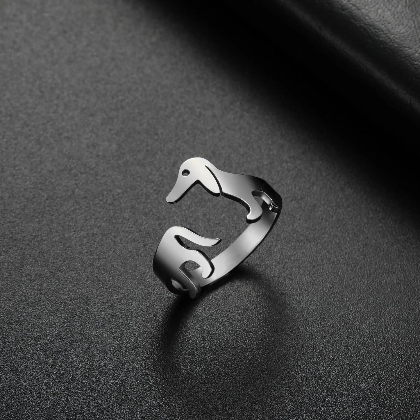 Adjustable titanium steel ring featuring a playful sausage dog design