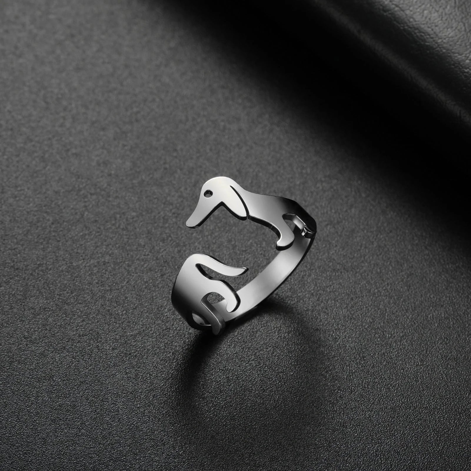 Adjustable titanium steel ring featuring a playful sausage dog design
