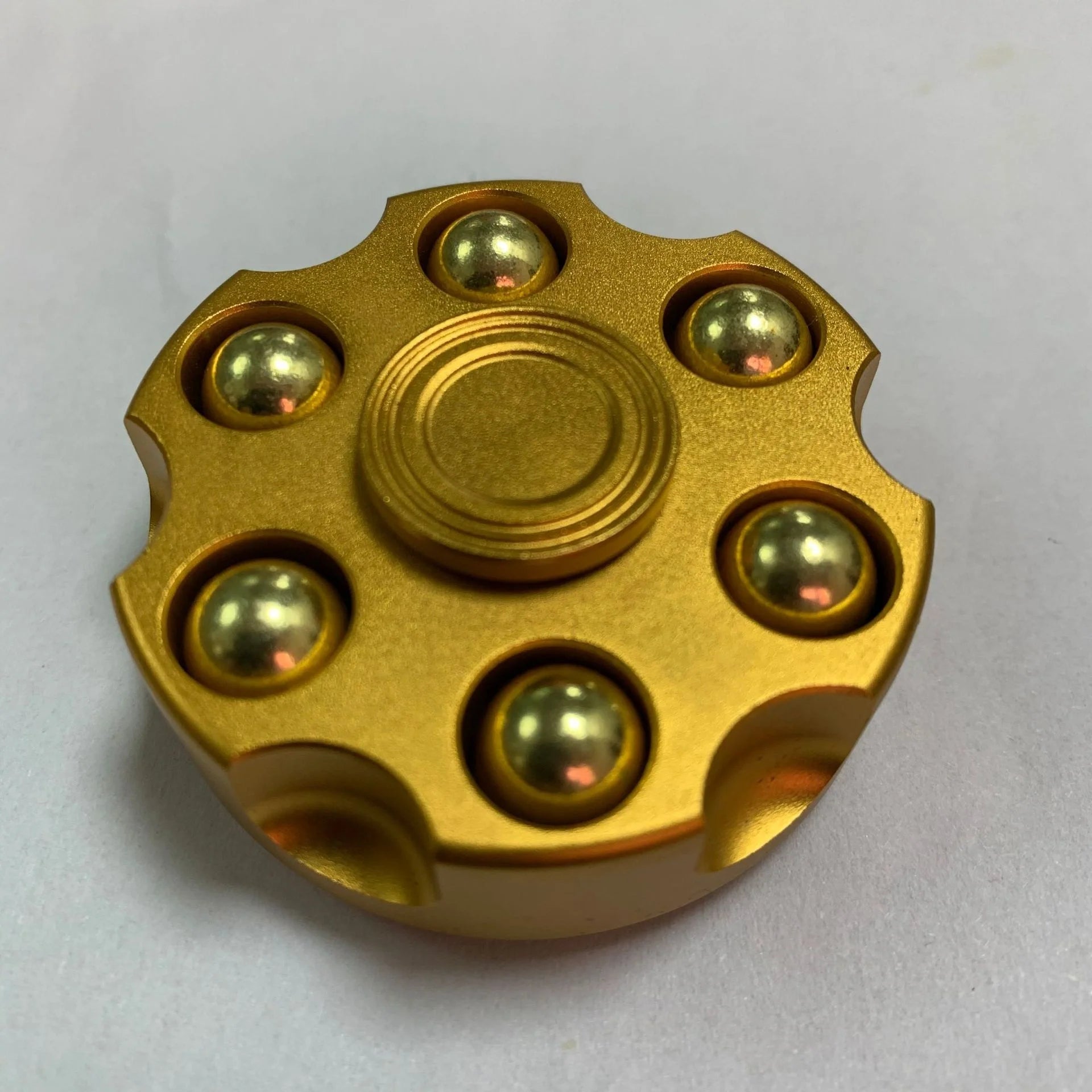 Brass gun revolver bullet fidget toy spinner with detachable rotating feature