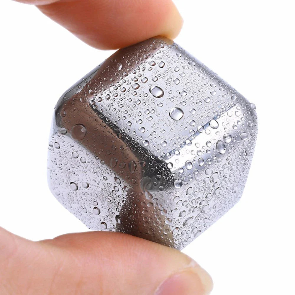 Premium stainless steel whisky chilling stones set in various shapes and sizes, including square, circular, heart, and diamond-shaped stones