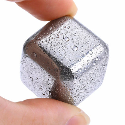 Premium stainless steel whisky chilling stones set in various shapes and sizes, including square, circular, heart, and diamond-shaped stones