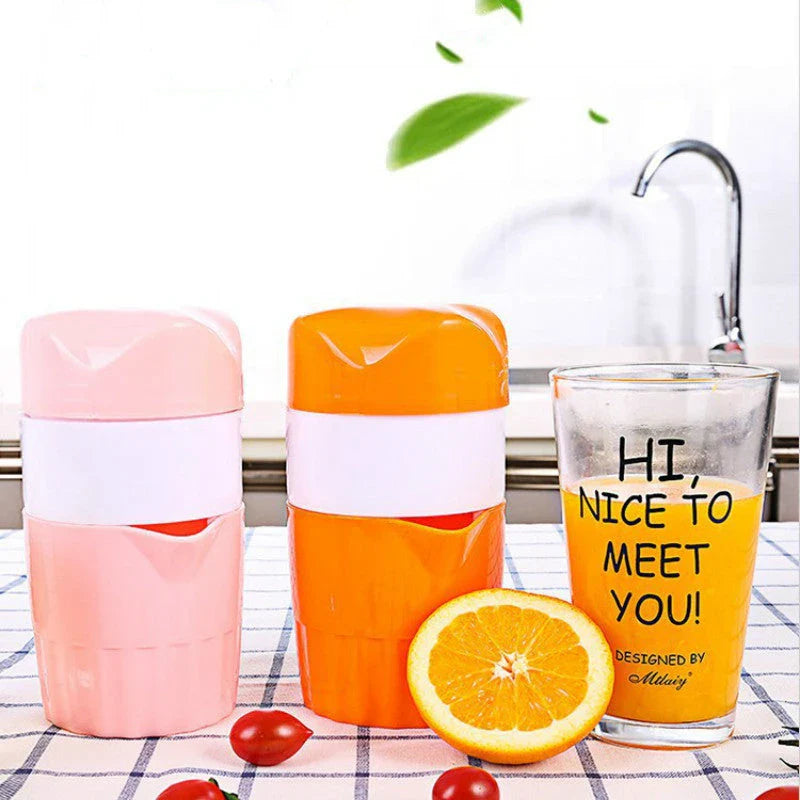 Premium manual citrus juicer with 300ml capacity, made of durable plastic and available in orange and pink colours