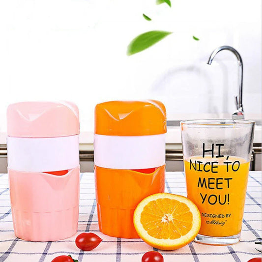 Premium manual citrus juicer with 300ml capacity, made of durable plastic and available in orange and pink colours